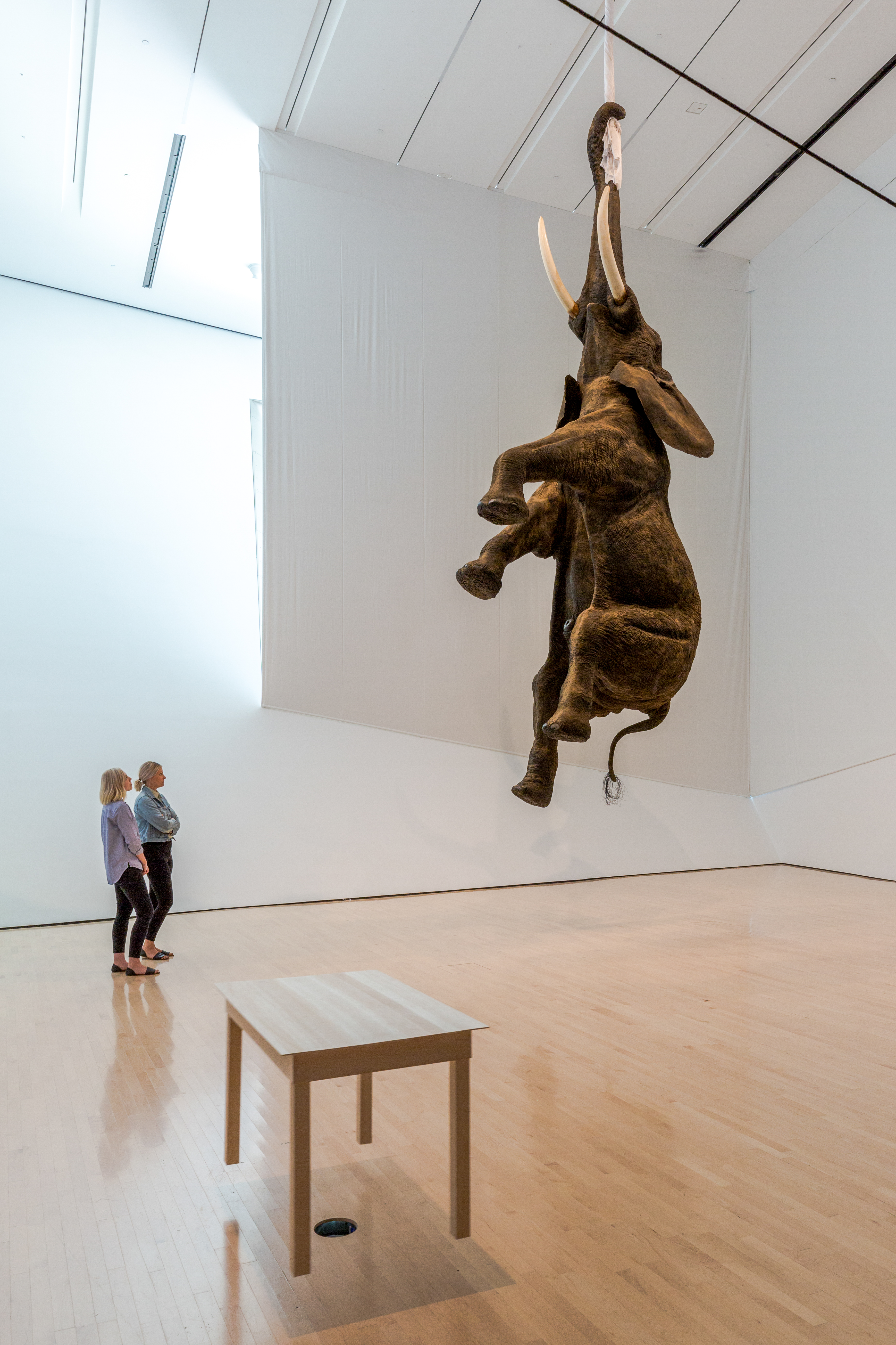 L to R: Ugo Rondinone, <i>​Clockwork for Oracles II</i>​, 2008, courtesy the artist and Gladstone Gallery, New York and Brussels; Jonathan Monk, ​<i>Second Hand Daily Exchange</i>​, 2006, courtesy the artist and Lisson Gallery, New York and London; Wolf Vostell, ​<i>Betonbuch​ (Concrete Book)</i>, 1971, University of Chicago Library, Special Collections Research Center; installation view at the MSU Broad, 2017. Photo: MSU Broad