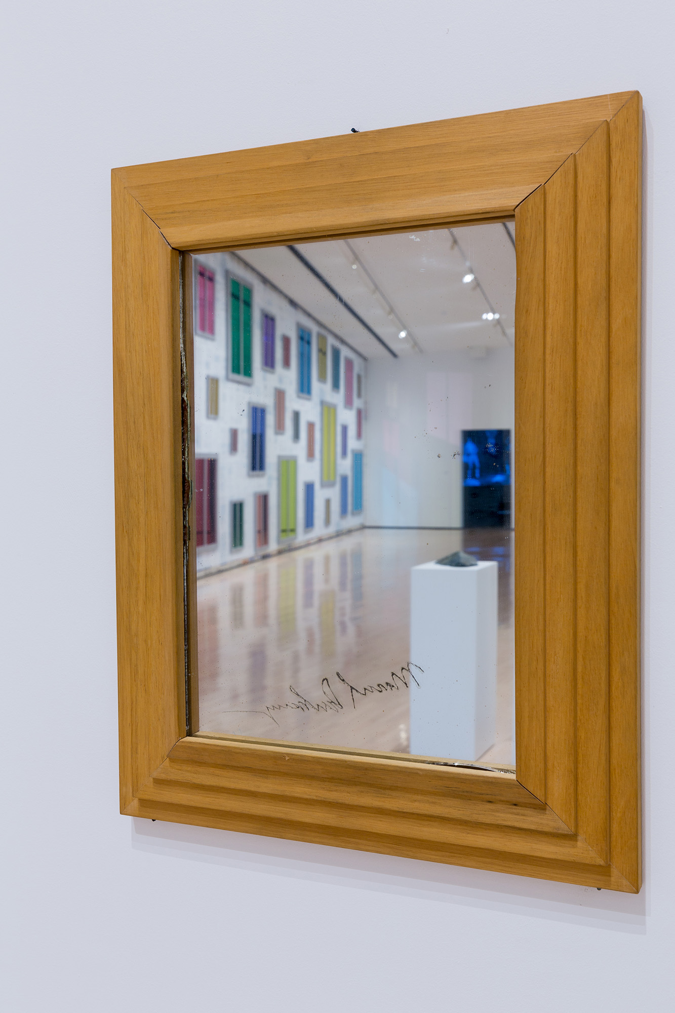 L to R: Ugo Rondinone, <i>​Clockwork for Oracles II</i>​, 2008, courtesy the artist and Gladstone Gallery, New York and Brussels; Jonathan Monk, ​<i>Second Hand Daily Exchange</i>​, 2006, courtesy the artist and Lisson Gallery, New York and London; Wolf Vostell, ​<i>Betonbuch​ (Concrete Book)</i>, 1971, University of Chicago Library, Special Collections Research Center; installation view at the MSU Broad, 2017. Photo: MSU Broad