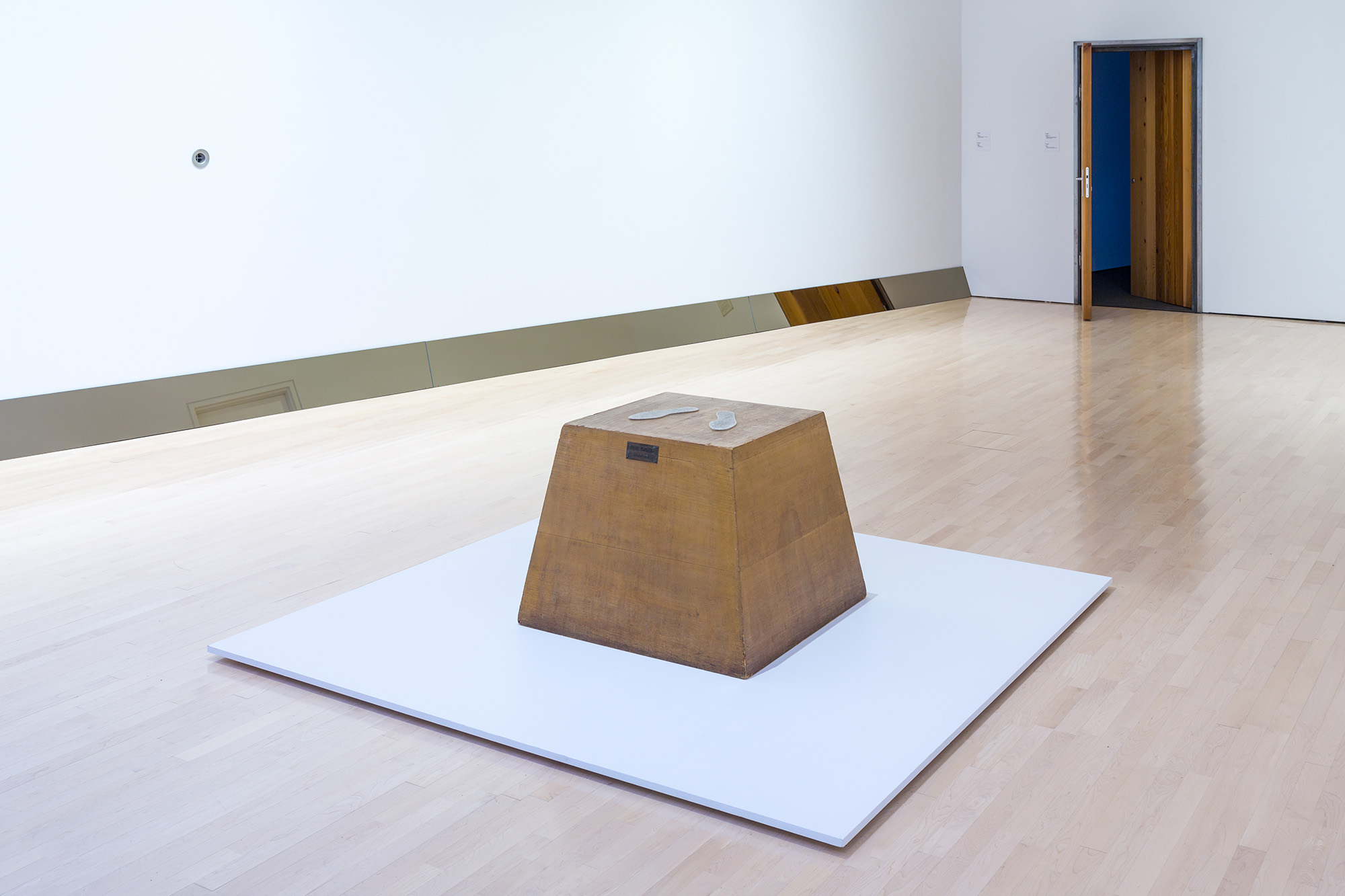 L to R: Ugo Rondinone, <i>​Clockwork for Oracles II</i>​, 2008, courtesy the artist and Gladstone Gallery, New York and Brussels; Jonathan Monk, ​<i>Second Hand Daily Exchange</i>​, 2006, courtesy the artist and Lisson Gallery, New York and London; Wolf Vostell, ​<i>Betonbuch​ (Concrete Book)</i>, 1971, University of Chicago Library, Special Collections Research Center; installation view at the MSU Broad, 2017. Photo: MSU Broad
