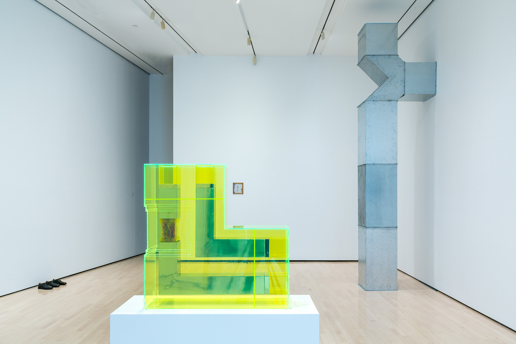 L to R: Ugo Rondinone, <i>​Clockwork for Oracles II</i>​, 2008, courtesy the artist and Gladstone Gallery, New York and Brussels; Jonathan Monk, ​<i>Second Hand Daily Exchange</i>​, 2006, courtesy the artist and Lisson Gallery, New York and London; Wolf Vostell, ​<i>Betonbuch​ (Concrete Book)</i>, 1971, University of Chicago Library, Special Collections Research Center; installation view at the MSU Broad, 2017. Photo: MSU Broad