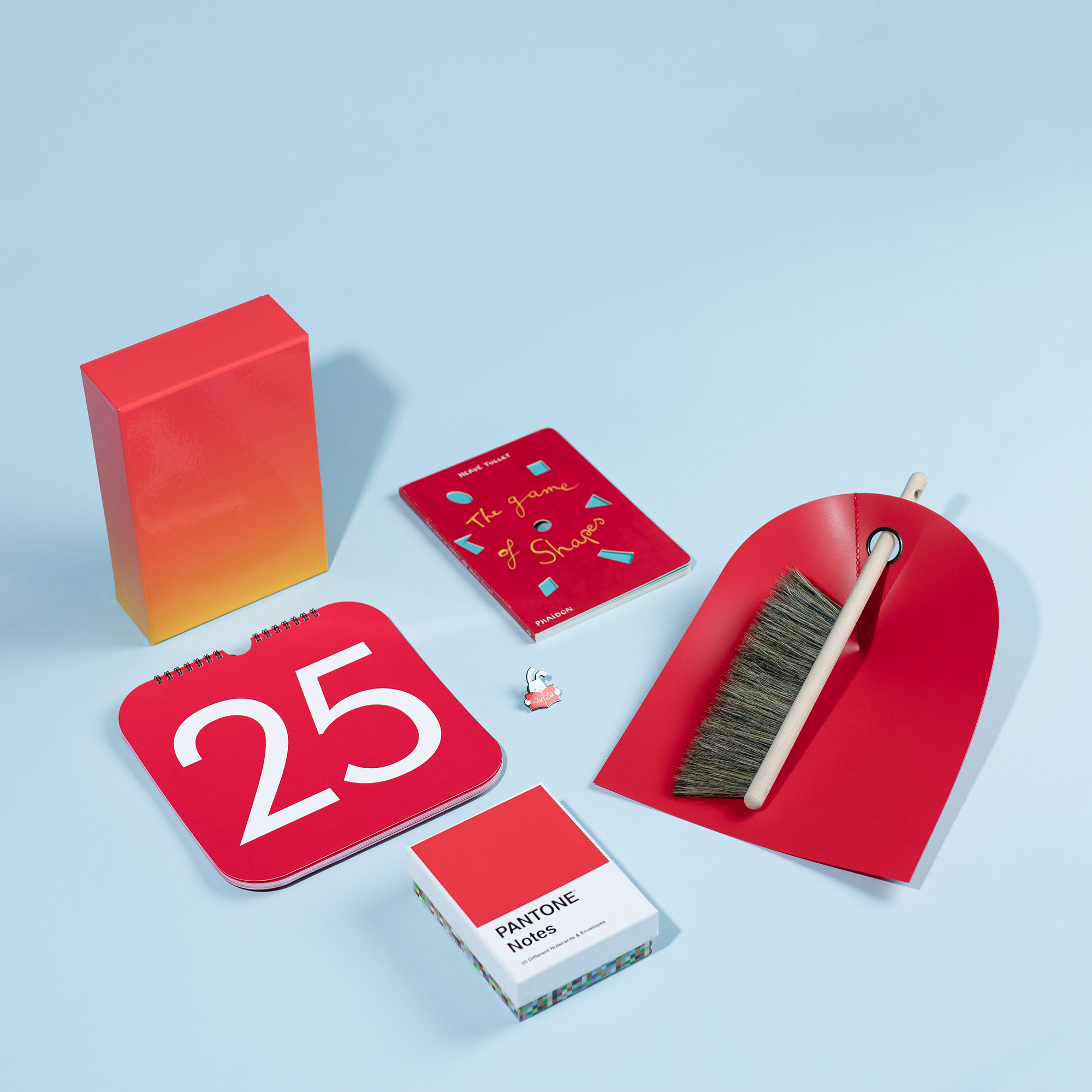 A calendar, notecards, and a broom and dustpan, all red on a blue background