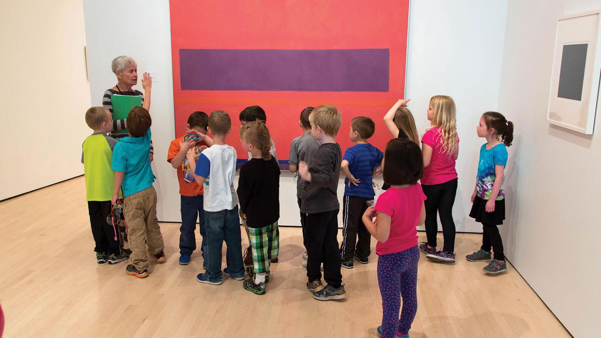 Children getting a tour of an art gallery